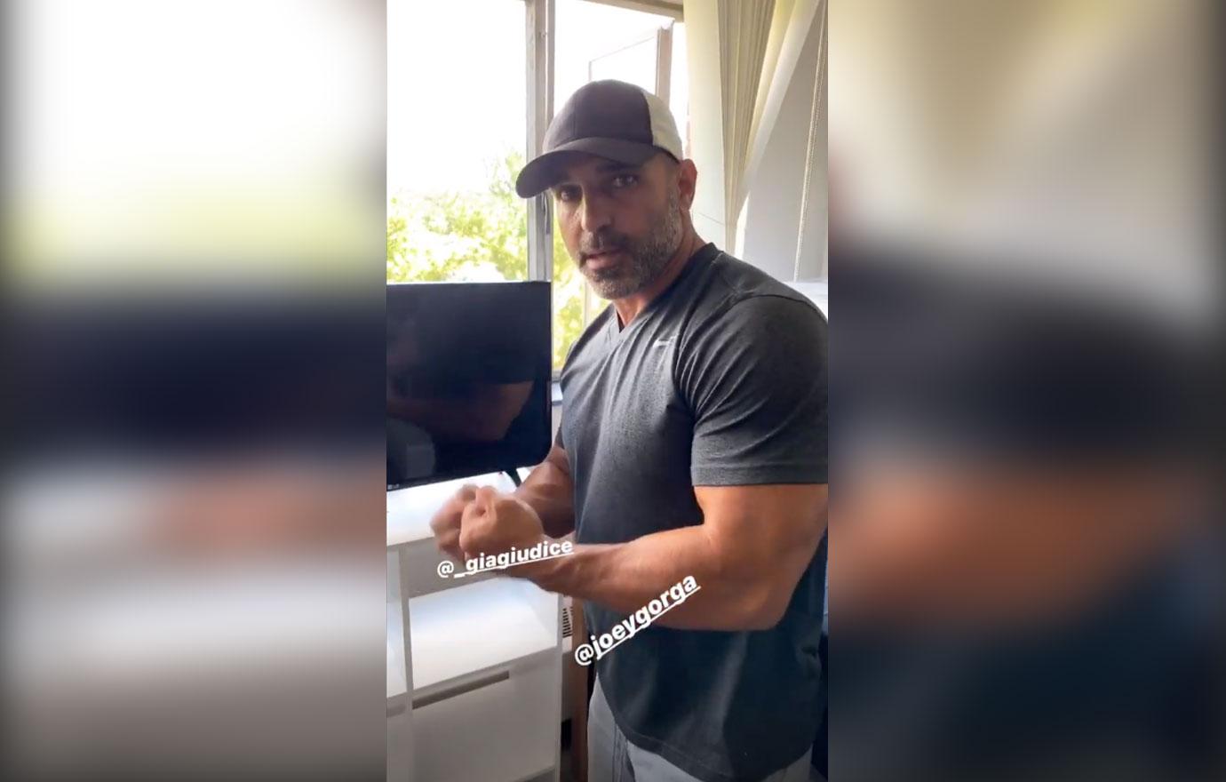 Joe Gorga showing off his muscles as he moves in his niece and daughter.