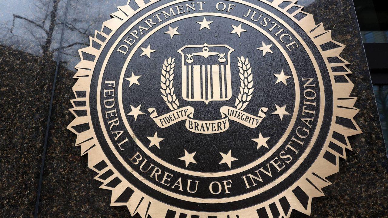 A photo of the Department of Justice and FBI seal