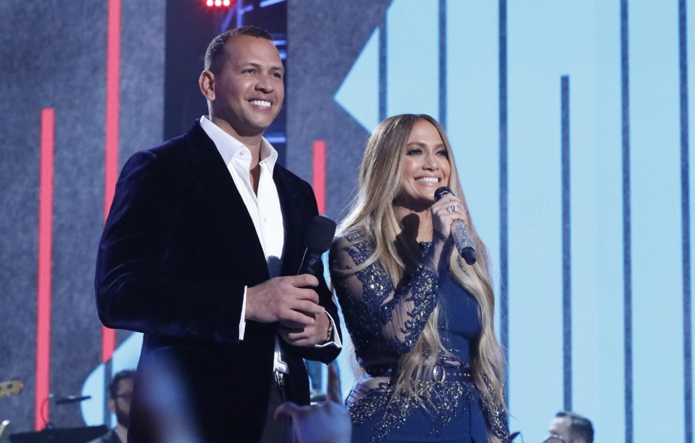 In this handout photo provided by One Voice: Somos Live!, (l-r) Alex Rodriguez and Jennifer Lopez participate in the phone bank during 'One Voice: Somos Live! A Concert For Disaster Relief' at the Universal Studios Lot on October 14, 2017 in Los Angeles, California. (Photo by Evans Vestal Ward /NBCUniversal/One Voice: Somos Live!/Getty Images)