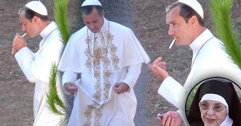 //jude law smokes cigarette dressed up as pope pp