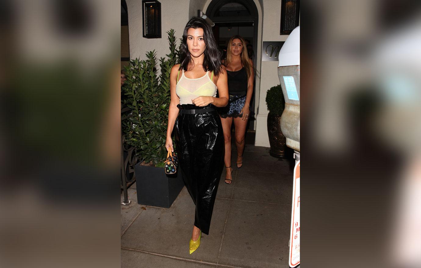 Kourtney Flashes Bra in Sheer Top While in NYC With Kylie