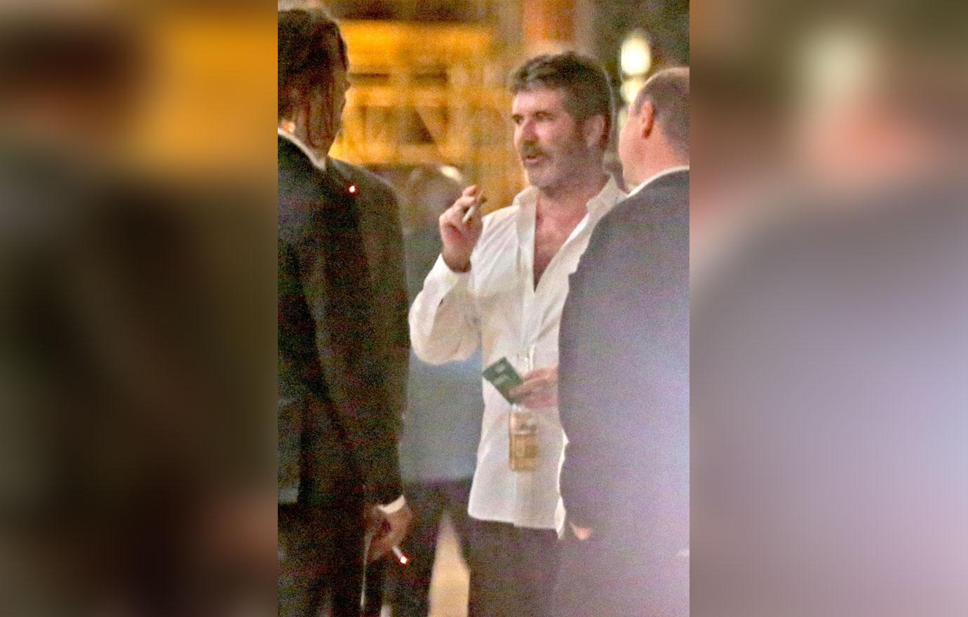 //Simon Cowell drinking after hospital