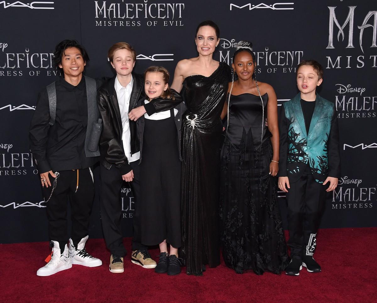 Jolie's children are encouraging her to travel while taking precautions.