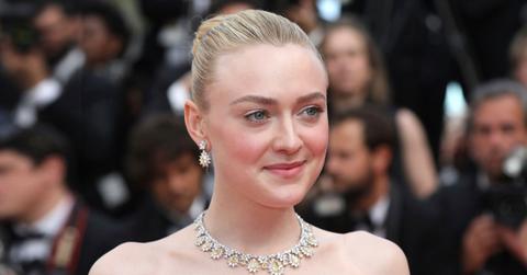 Dakota Fanning Wearing White and Yellow Diamond Earrings and Necklace Shocks Fans By Posting Nude Photo Of Herself Doing Makeup In Bathroom