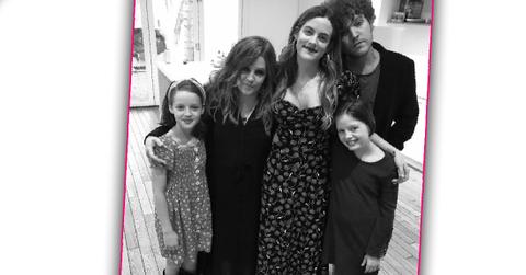 Lisa Marie Presley stands with her four kids.