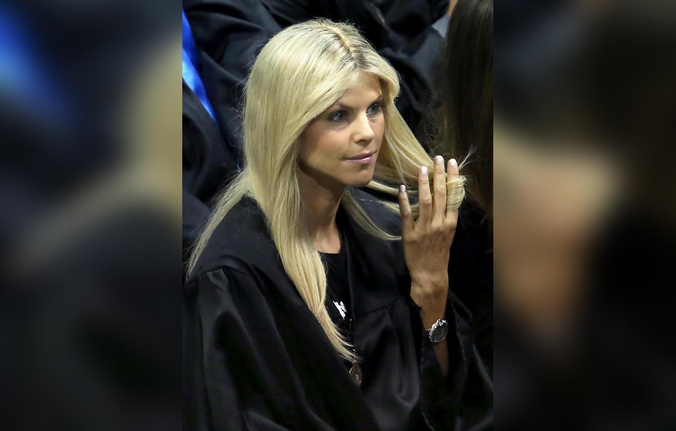 Elin Nordegren In Black Graduation Gown Twirls Her Hair At Commencement Ceremonies