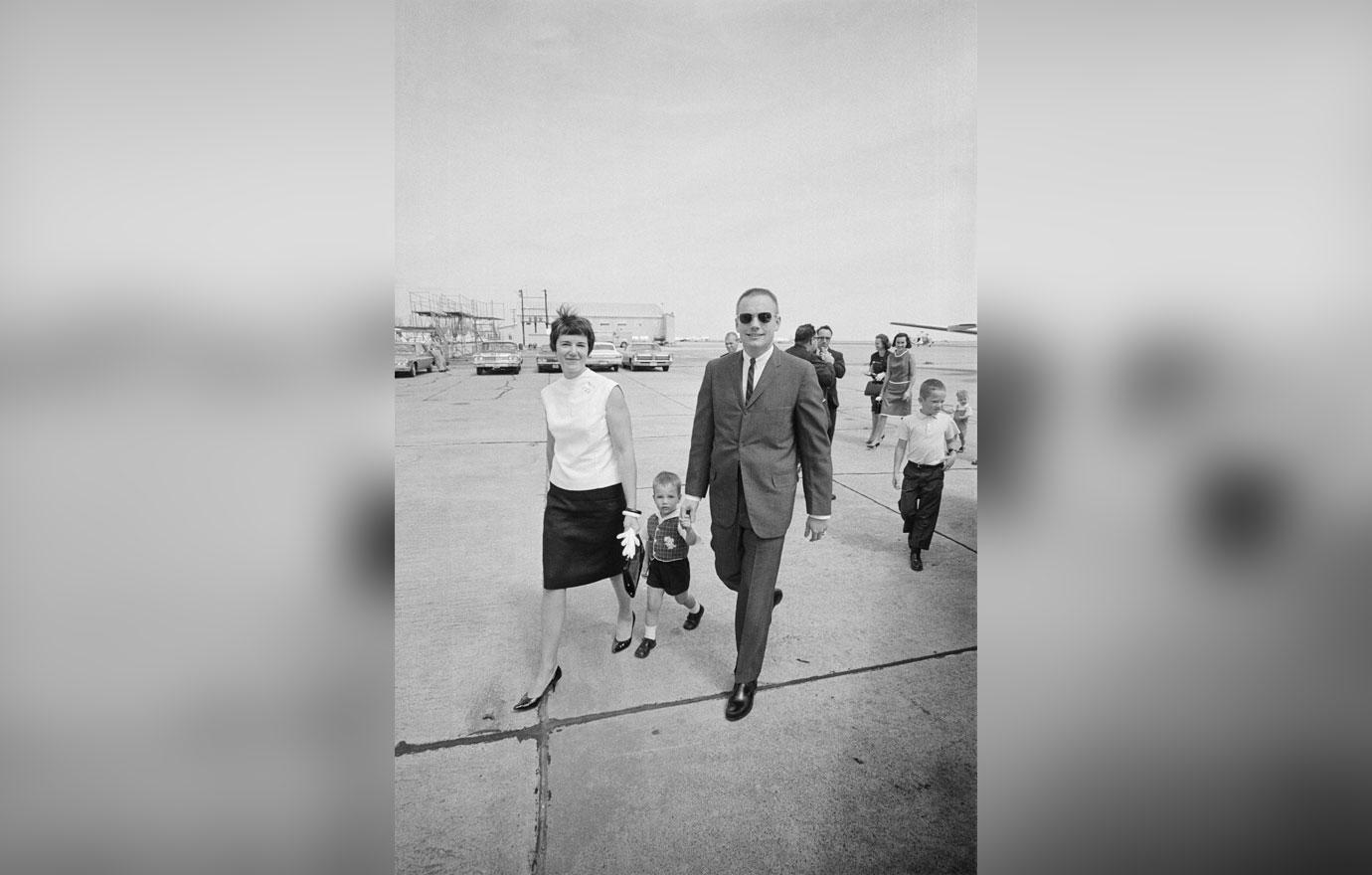 Gemini 8 Command Pilot Neil A. Armstrong leaves Ellington Air Force Base with his wife Janet, and their two-year-old son Mark in this photo, as he returned home for the first time following the incompleted flight of Gemini 8.