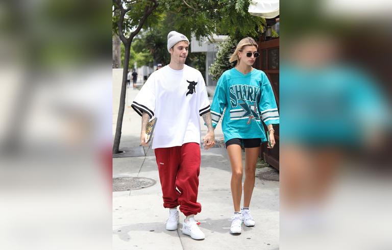 Justin Bieber & Hailey Baldwin Hold Hands In Oversized Jerseys