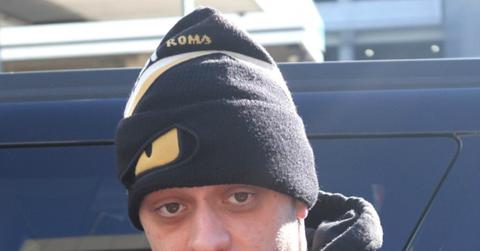 Pete Davidson looks into the camera while wearing a hat.