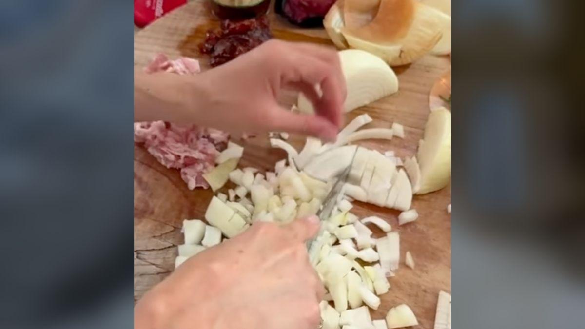 Photo of Meghan Markle chopping onions