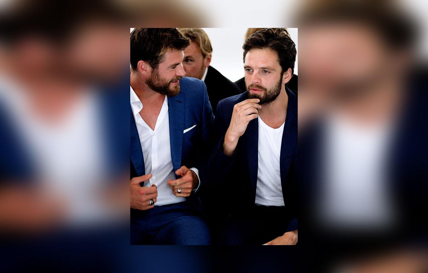 // Recently announced Boss Bottled Fragrance Ambassador Chris Hemsworth front row at BOSS Menswear Fashion Show Spring Summer  alongside Sebastian Stan