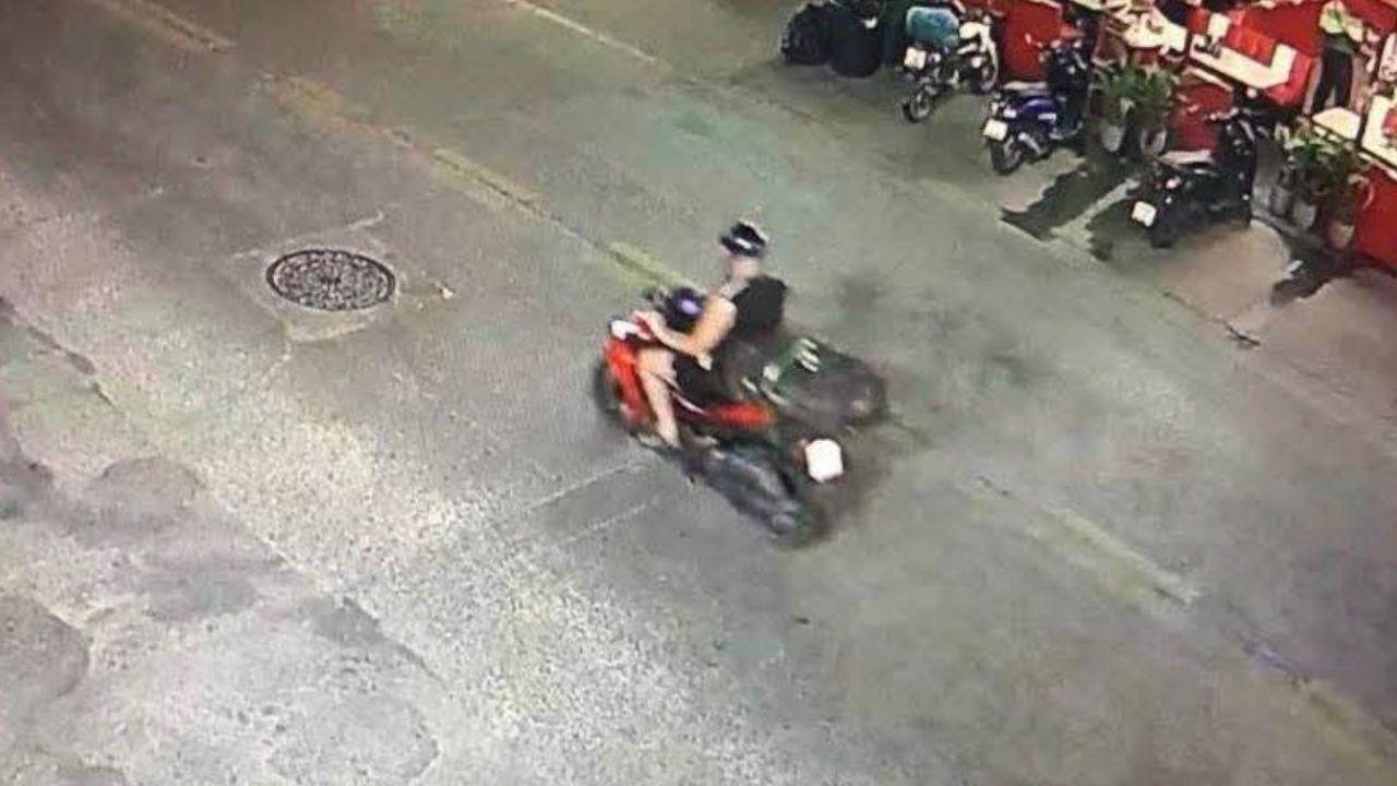 Photo of Carman escaping with suitcase