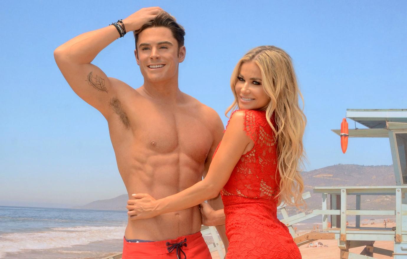 Carmen Electra poses with a wax model of Zac Efron.