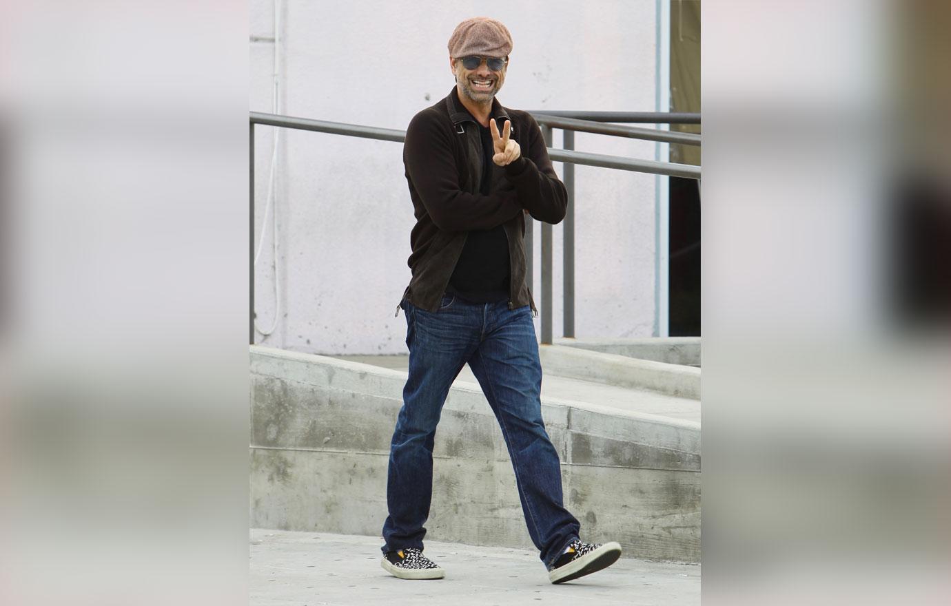 John Stamos Wearing Light Brown Cap, Sunglasses, Dark Brown Sweater and Jeans