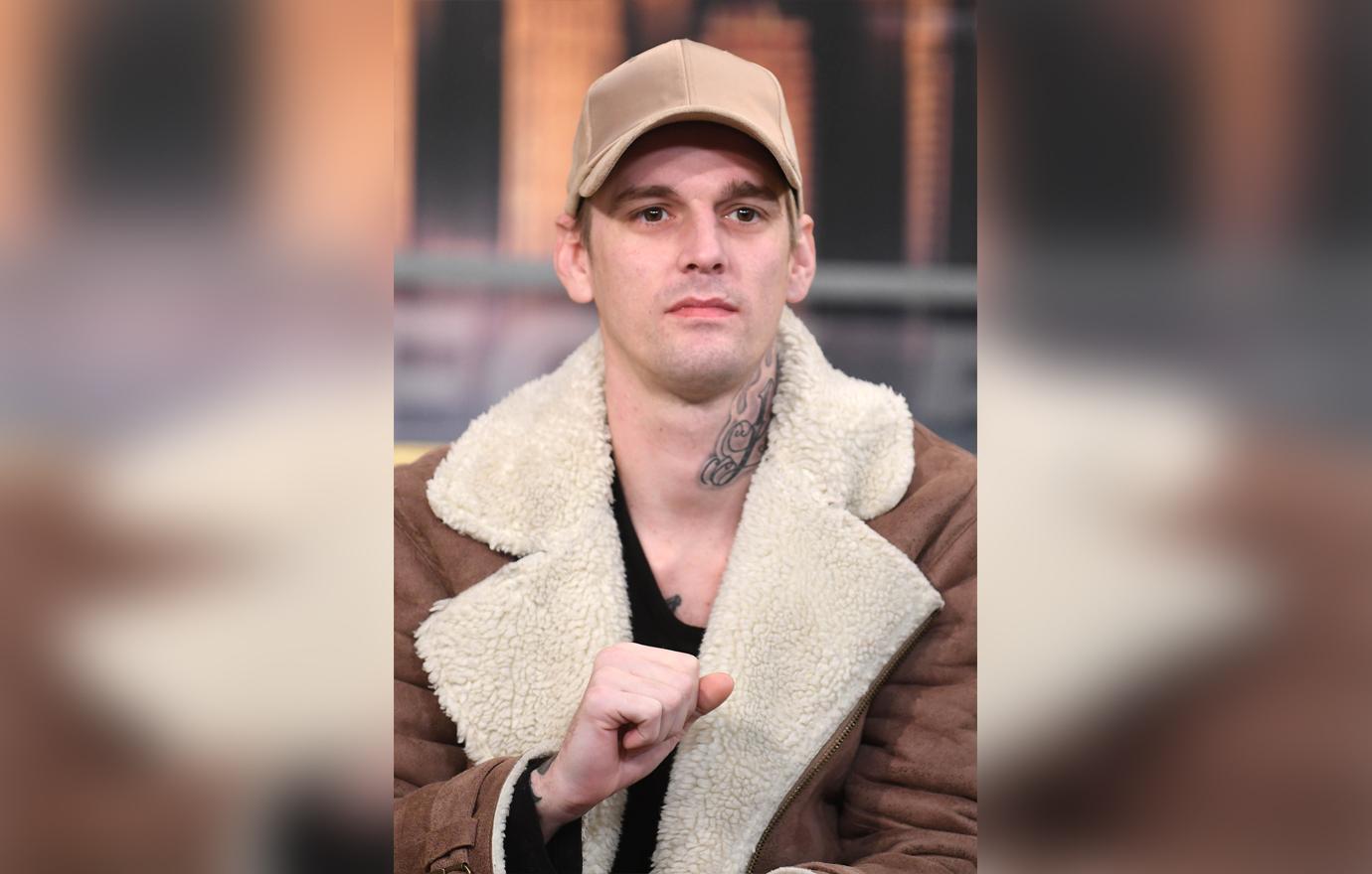 Aaron Carter Looking Serious Wearing Baseball Cap and Coat Feud With Brother Nick