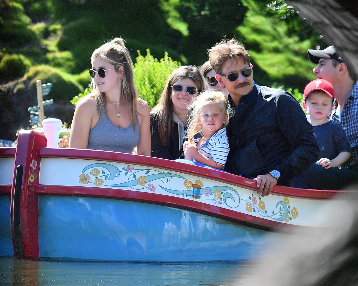 Bradley Cooper enjoys a day at Disneyland with his daughter Lea.