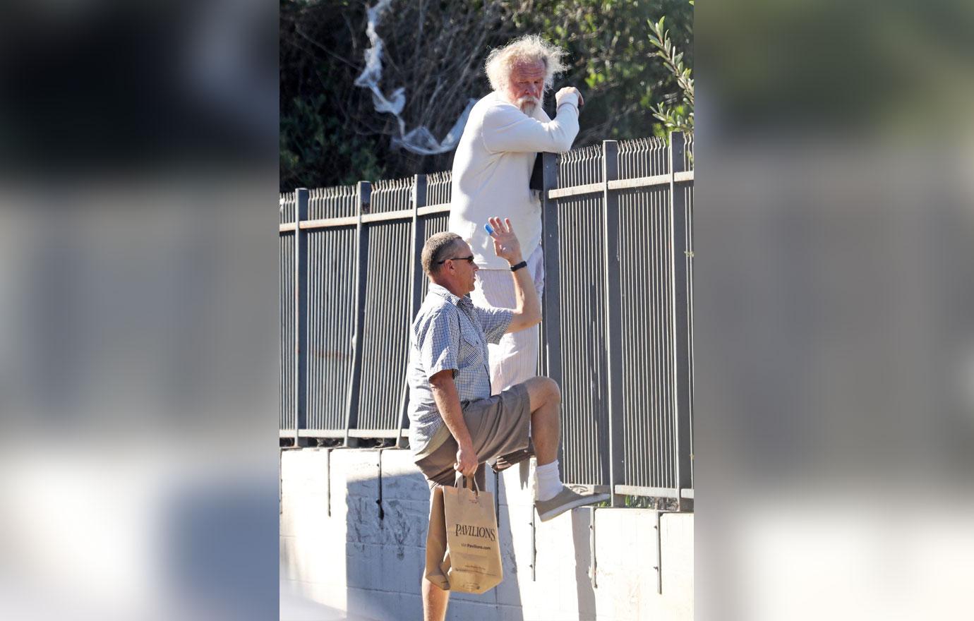 //Nick Nolte Climbs Fence Photos