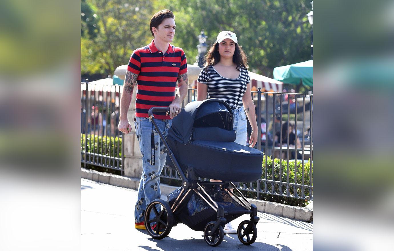 drake bell holds baby disneyland first public appearance photos pleads guilty child endangerment