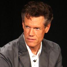 //randy travis critical