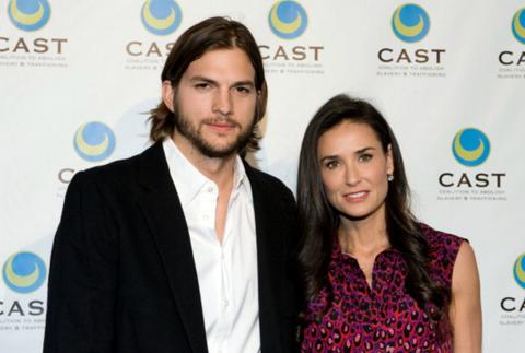 Demi Moore and Ashton Kutcher pose on the red carpet.