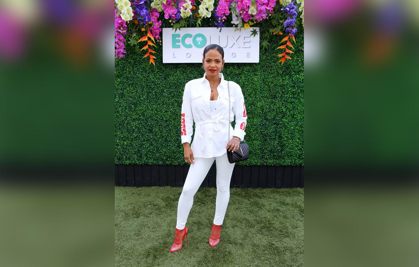 Christina Milan Poses in Chic White Outfit Outside EcoLuxe Lounge