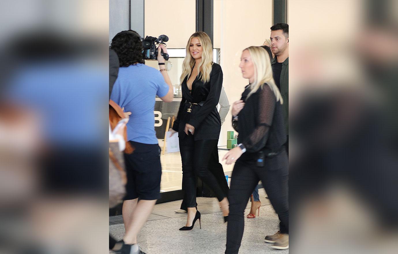 Pregnant Khloe Kardashian Covers Baby Bump During Promotional Appearance