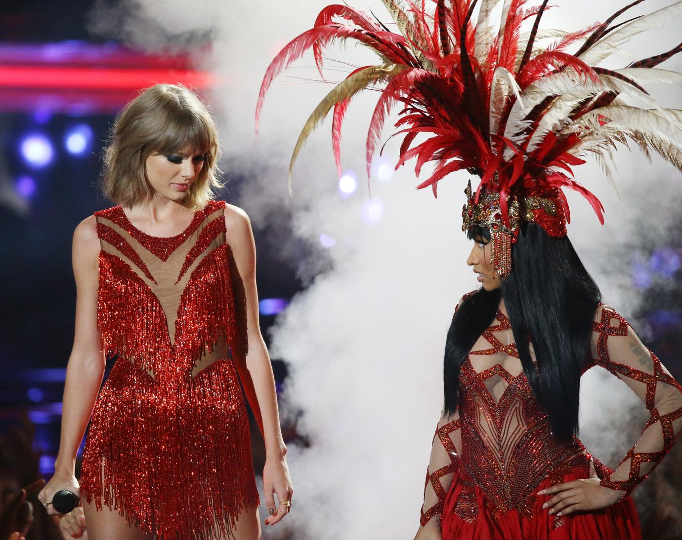 Taylor Swift and Nicki Minaj Perform Onstage Wearing Coordinating Red Sparkly Tassle Ensembles And Look at Eachother