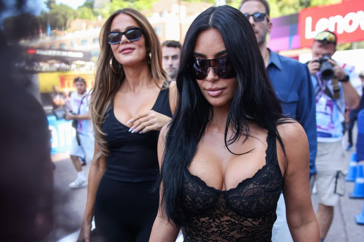 An insider claimed Hamilton has defended Kardashian, calling her his 'good luck charm.'