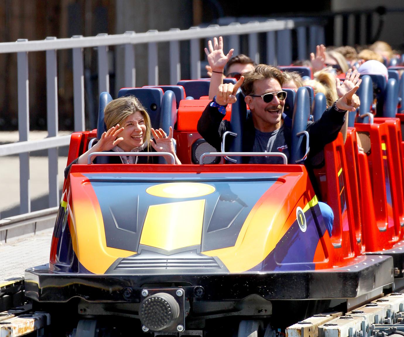 Bradley Cooper enjoys a day at Disneyland with his daughter Lea.