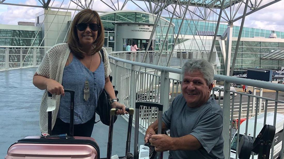 Matt Roloff and Caryn Chandler pose for a photo at their nearby airport.