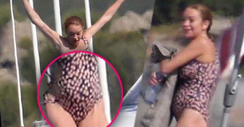 lindsay lohan pregnant bathing suit baby bump italy yacht pics