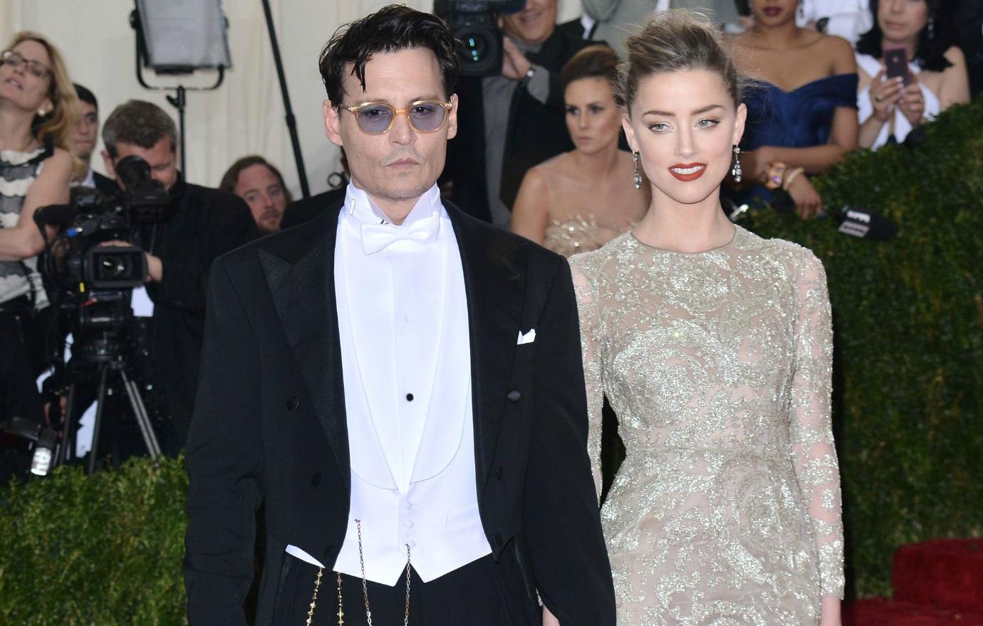 Johnny Depp wore an old-school tuxedo, complete with a stringed pocket watch, while Amber Heard dazzled in a patterned grey gown.