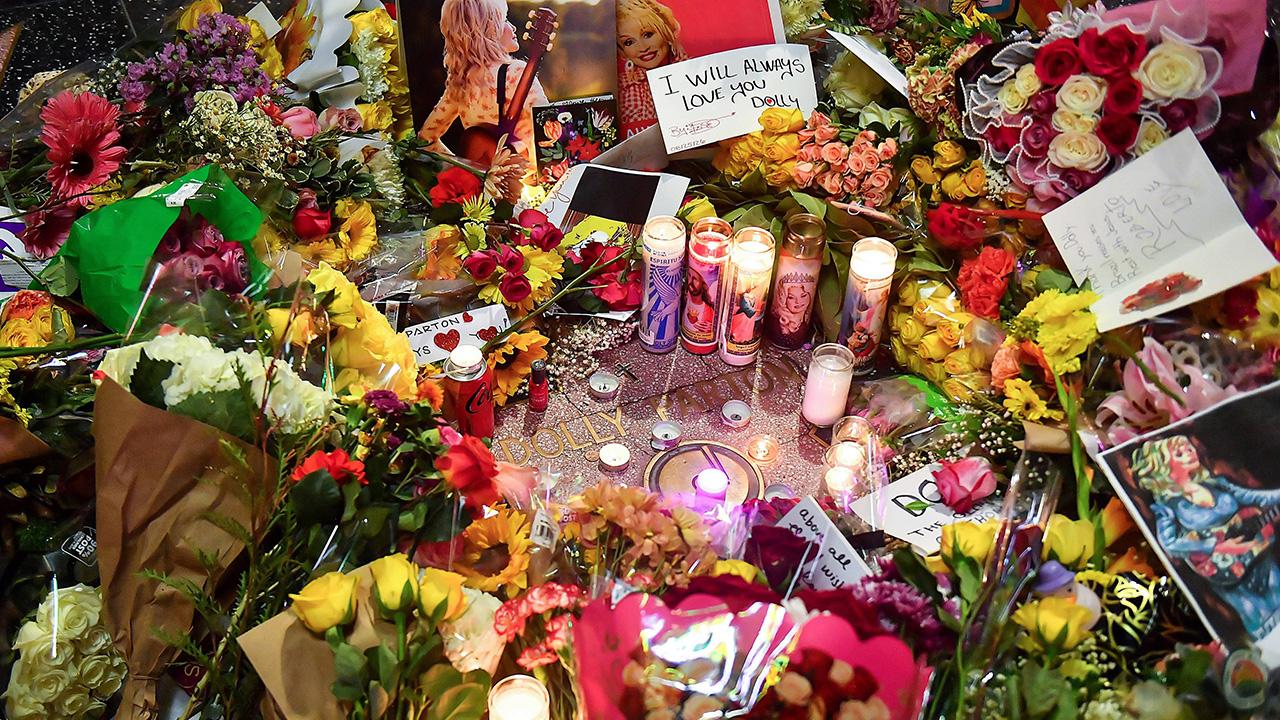 Cards, flowers and mementos continue to be dropped off from mourners.
