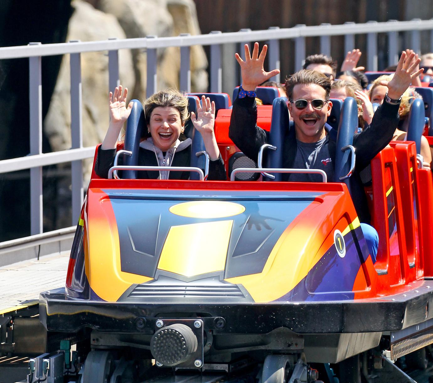 Bradley Cooper enjoys a day at Disneyland with his daughter Lea.