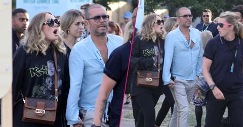 Adele is seen surrounded by bodyguards while holding hands with a male friend in Hyde Park, London, where Celine Dion was headlining.