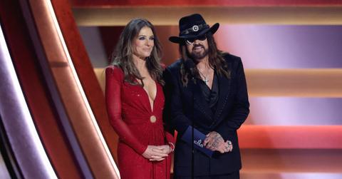 Liz Hurley stands by her boyfriend Billy Ray Cyrus as he faces public bashing from his ex.