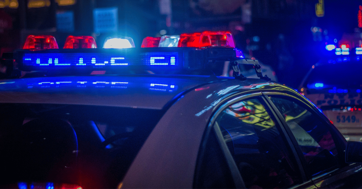 Photo of police car with lights on