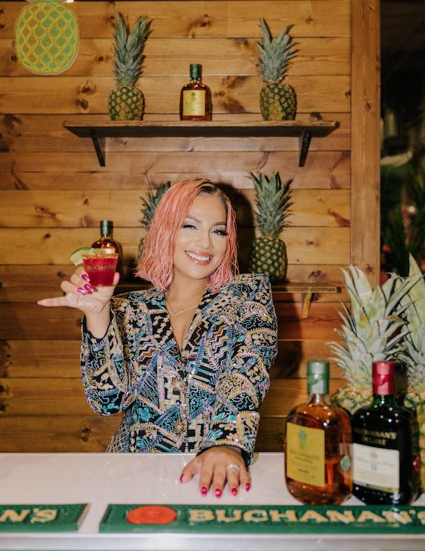 yvonne guidry and buchanans whisky celebrate the ers at the nd annual spoiled latina summit in houston txphoto creditalan castelan