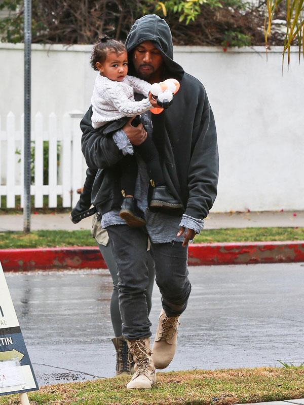 Kanye Kisses North West