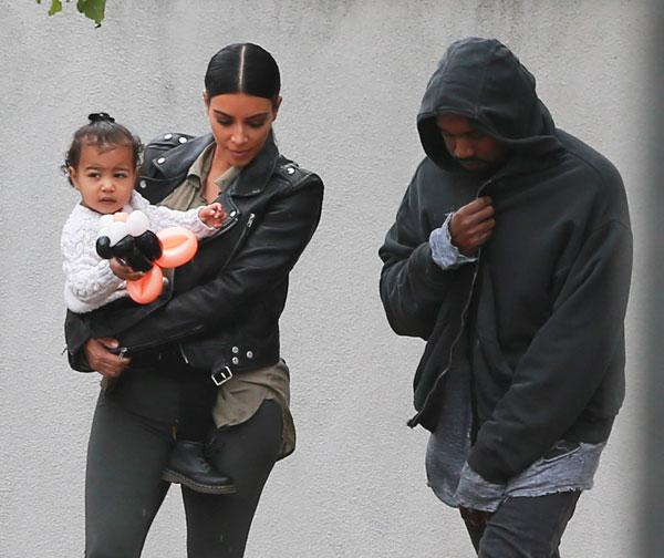 Kanye Kisses North West