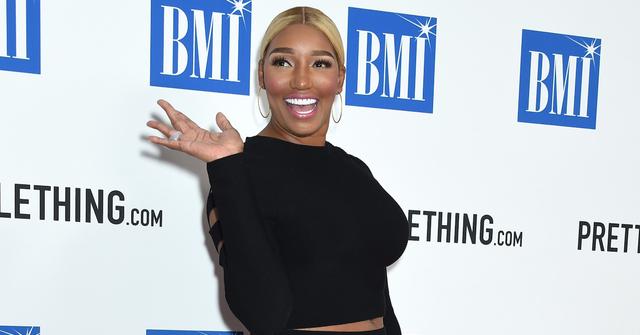 woman waving on red carpet