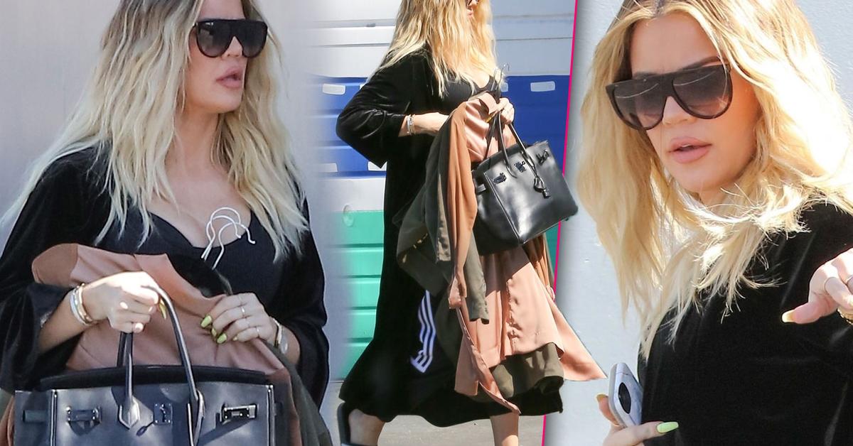 Khloe Kardashian Covers Growing Baby Bump From Cameras