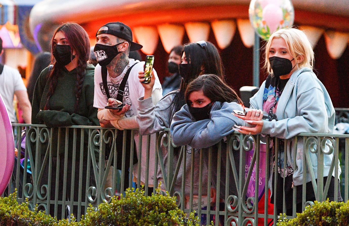 kourtney kardashian and travis barker take their modern family on a fun day out at disneyland