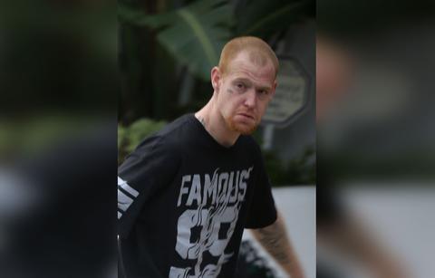 Redmond O'neil Looking at Camera in Back Shirt