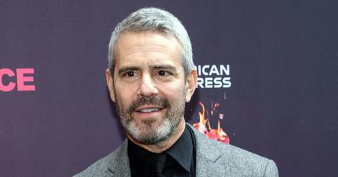 Andy Cohen With Full Beard and Mustache, Wearing Black Shirt and Tie With Gray Heathered Blazer