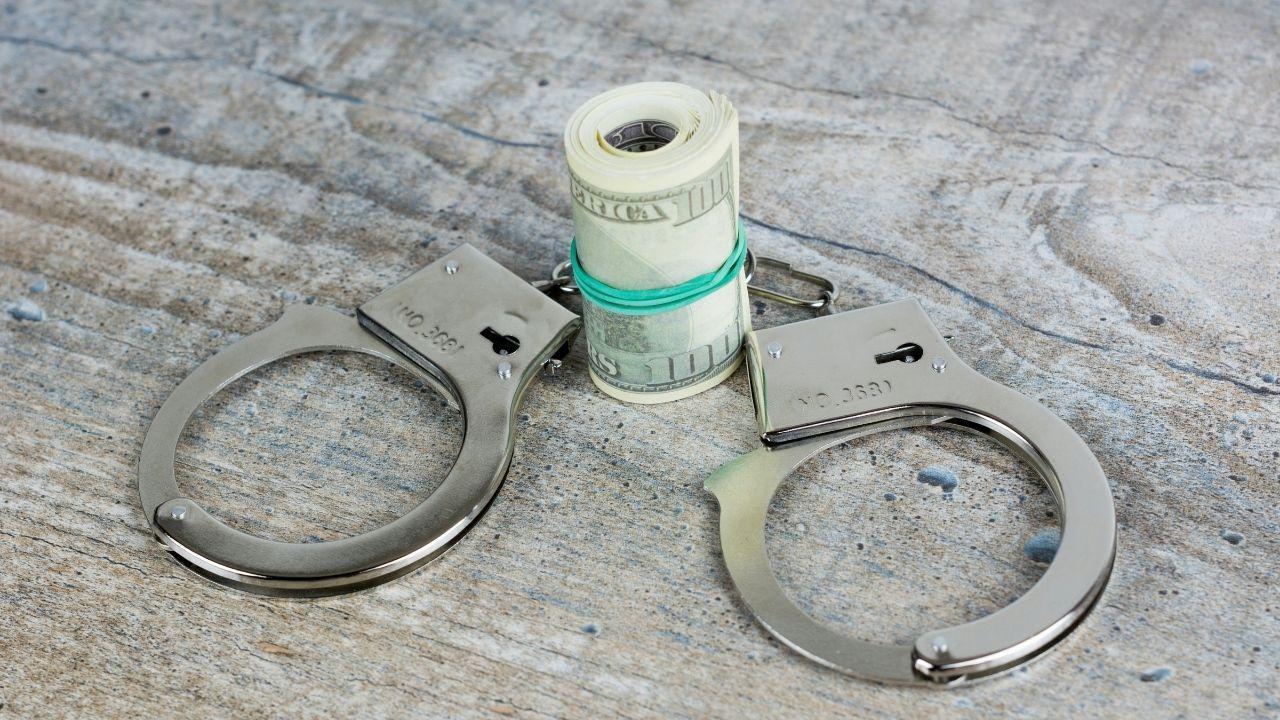 Photo of cash wand and handcuffs