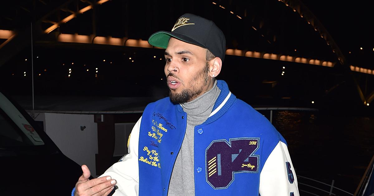 chris brown cops called to la mansion man spits on security