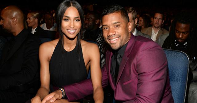 Ciara and Russel Wilson smile for a photo.
