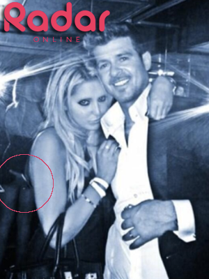 Robin Thicke posts pic of wife's near nip slip days after controversial  'mirror' photo