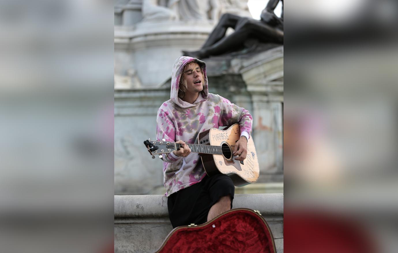 justin bieber street busking playing money outside buckingham palace marriage rumors